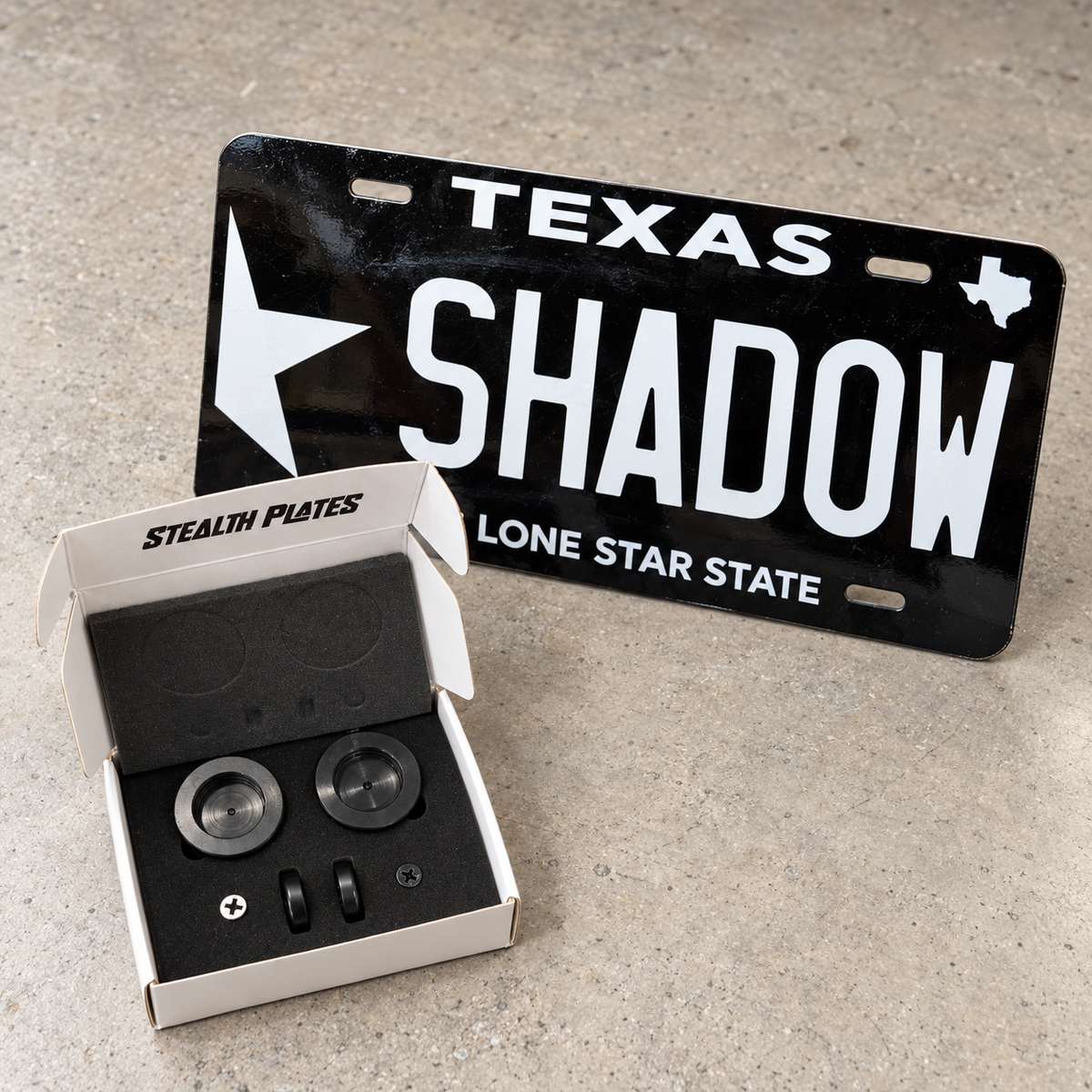 One SHADOW custom plate with an open Stealth Plates magnetic mounting kit.