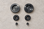 Two large magnetic pucks, two matching circular attachments and two mounting screws.
