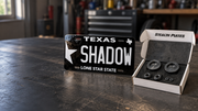 SHADOW custom plate and Stealth Plates magnetic kit on a garage workbench.